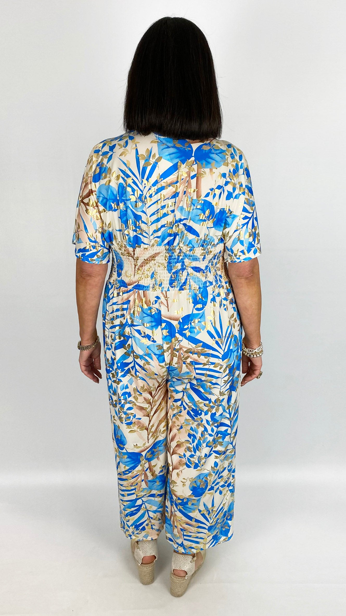 Crease-free crossover jumpsuit | 4 Gold-enhanced prints