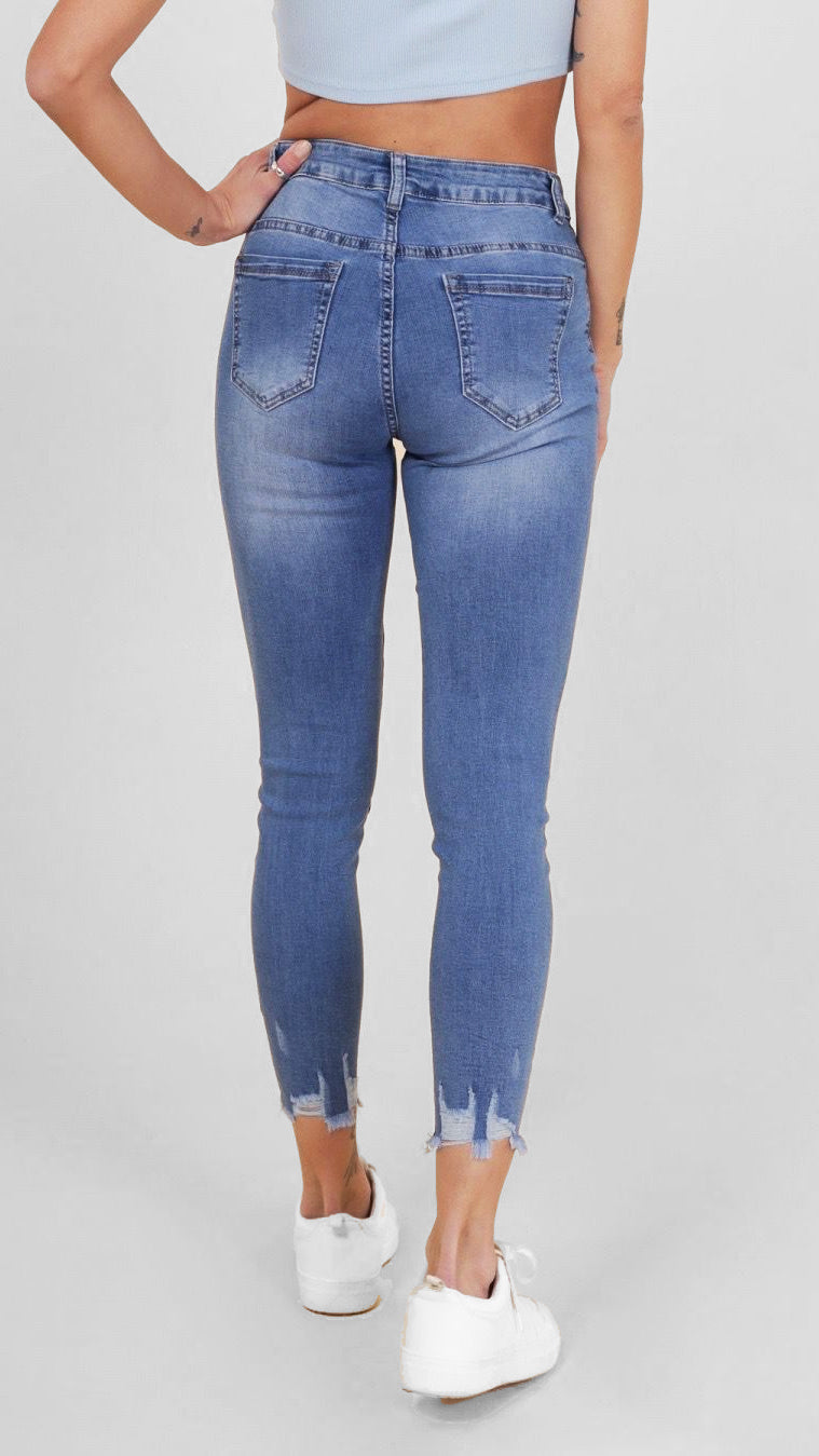 Frayed-hem stretch denim jeans